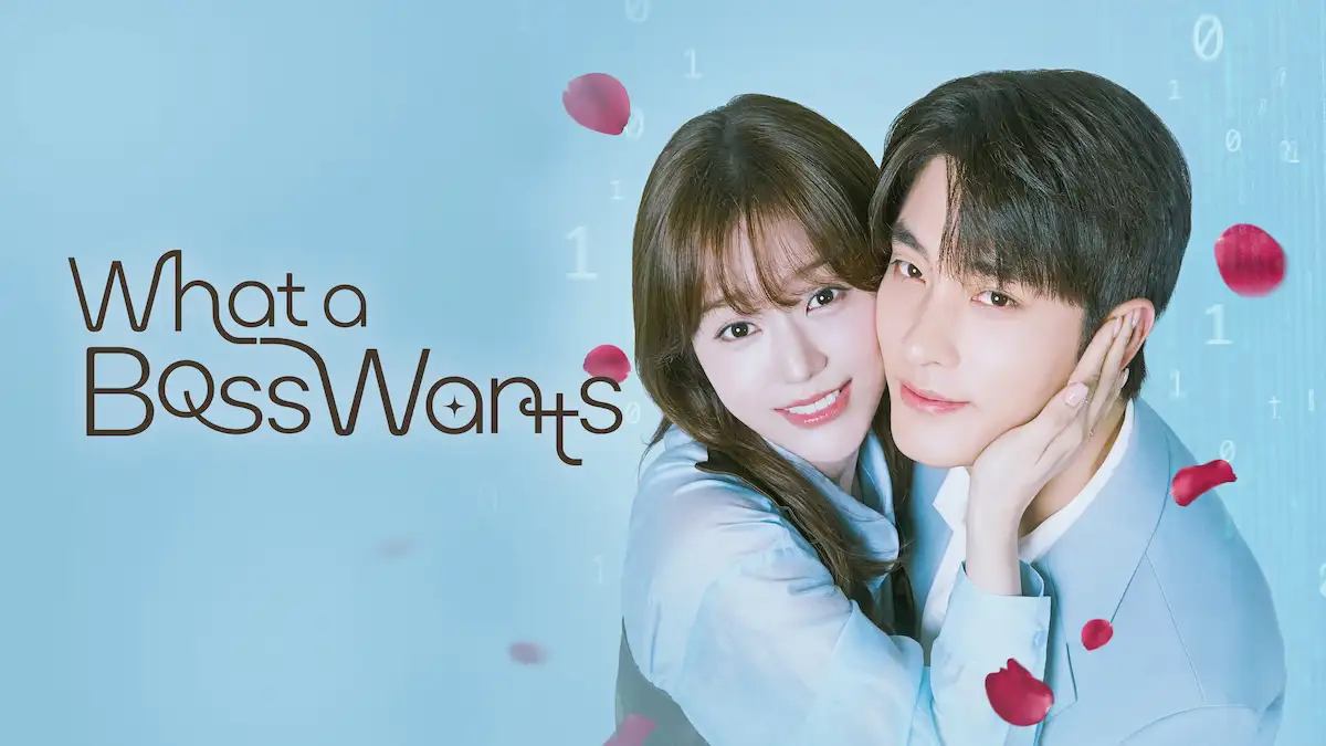A smiling woman embracing a man and gently holding his cheek against a light blue background with falling red rose petals and binary code overlay, featuring brown text reading What a Boss Wants.