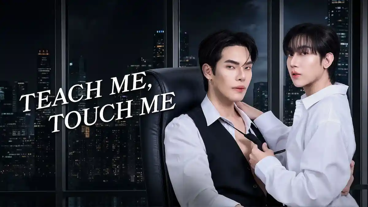 Two young men in white shirts posing intimately in a high-rise office at night with city skyline lights